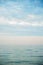 Seascape with sea horizon and blue sky. Background. Painterly seascape scene with relaxing sunset colours