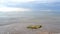 Seascape of sea sandy shore in quiet calm rainy weather with clouds