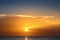 seascape with shiny sea over cloudy sky and sun during sunset in Cozumel, Mexico