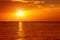 seascape with shiny sea over cloudy sky and sun during sunset in Cozumel, Mexico