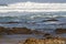 Seascape showing rocks emerging at low tide