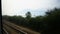Seascape shown from train moving on railway track, summer vacation, travel