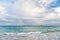 Seascape and sky with clouds, white cloudscape. Sea waves on cloudy sky in philipsburg, sint maarten. Beach vacation at Caribbean,