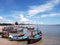 Seascape; Small fishing boat on beach in blue sky