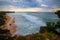 Seascape. Spectacular view from Balangan cliff in Bali. Sunset time. Blue hour. Ocean with motion foam waves. Waterscape for