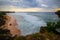 Seascape. Spectacular view from Balangan cliff in Bali. Sunset time. Blue hour. Ocean with motion foam waves. Waterscape for