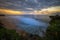 Seascape. Spectacular view from Balangan cliff in Bali. Sunset time. Blue hour. Ocean with motion foam waves. Waterscape for