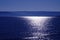 Seascape, sunlight reflected in calm blue water