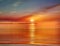 Seascape sunset over sea blue sky gold pink yellow sunlight dawn sunbeams reflection on ocean water nature landscape