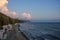 Seascape sunset sun sets orange Cumulus clouds sea waves. stones coast Anapa