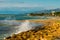 Seascape, surf at stones ridge on the shore