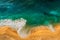 Seascape top view. Panoramic view of the sea waves. Foamy waves roll over the seashore. A vivid picture of marine nature.