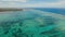 Seascape with tropical island, beach, rocks and waves. Siargao, Philippines.