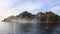 Seascape and vegetation in Portofino, Italy. Clouds close to shore.