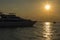 Seascape view of a large motor yacht at sunset in Dubai