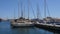 Seascape view with yachts and ships in marina port on sunny day