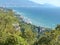 Seascape. View of Yalta from the Solar path. Southern coast of Crimea. Evergreen trees on the background of a calm sea