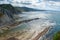 Seascape with views of the Zumaia flysch, on Algorri beach, a sunny summer afternoon