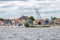 Seascape village Urk with wind turbines raising above the houses