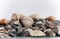Seashell on a background of stones. Marine background