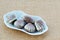 Seashell chocolate candies in white porcelain dish