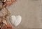 Seashells heart and sand background horizontal