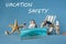 Seashells, starfish, sun lounger, lifebuoy behind a medical mask. Safe vacation concept