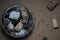 Seashells, wine corks, chestnuts and cones in glass wine