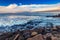 Seashore with cliffs, waves crashing on rocks