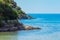 Seashore coastline with cliff and rocks on a mountain slope. Blue sea of the Island of Elba in Italy in the Tuscany region.