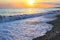 Seashore with pebble beach at sunset sea tide