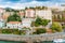 Seashore with road and buildings with greay sky