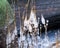 the seashore, rocky seashore, bare ice, blades of grass frozen with pieces of ice, natural formations