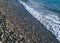 Seashore with stones, pebble closeup, beach