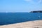 Seashore view on sea with sailing boats