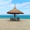 Seaside with beach umbrella and sun loungers
