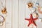 Seaside decorations on light wooden planks: shells, sea stars, s