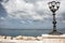 Seaside with iron street lamp on cloudy day muted colors. Adriatic seascape. Italian panoramic coastline. Italian south .