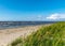 Seaside landscape from Estonia, sea grasses and rocks in shallow sea water, Kabli bird center, Parnu Bay, Estonia