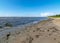 Seaside landscape from Estonia, sea grasses and rocks in shallow sea water, Kabli bird center, Parnu Bay, Estonia