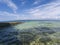 Seaside landscape in fisheye lens, tropical seashore photo. Turquoise blue sea water and blue sky double landscape.