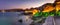 Seaside landscape, panorama, banner - view of the embankment with fortress wall during sunset in the city of Sozopol