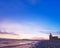 Seaside lighthouse, beautiful sunset, blue sky background, copy space