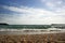 Seaside, pebbles, wavy sea and endless blue sky in Istanbul.