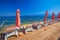 Seaside promenade on Brac island with palm trees and turquoise clear ocean water, Supetar, Brac, Croatia.