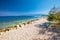 Seaside promenade on Brac island with palm trees and turquoise clear ocean water, Supetar, Brac, Croatia.