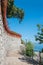Seaside promenade from Icici to Opatija, Croatian landscape Kvarner Bucht, geranium flowers at the wall