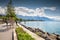 Seaside promenade in Vevey town near Montreux with Swiss Alps in background, Switzerland, Europe