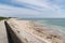 Seaside protection dike against waves on island of Re in France with path  Sea and Breakwater