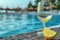 Seaside relaxation table with empty wine glass, lemon, beach scene